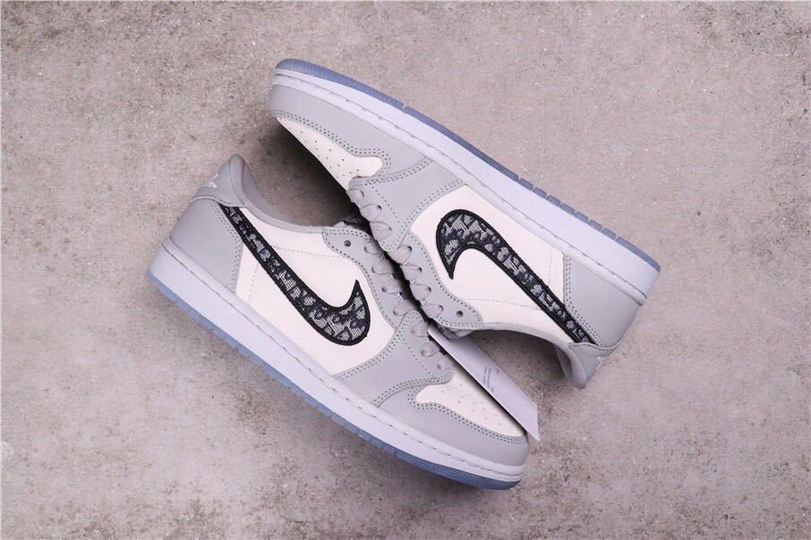 Pair of sneakers arranged in an overlapping side view, showing the low-top profile and translucent outsoles.