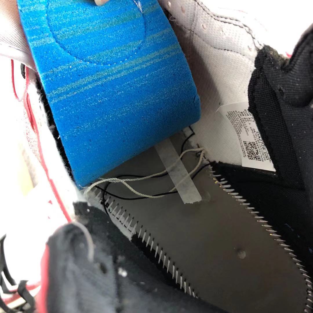 Close-up of the sneaker interior, insole and attached product label.