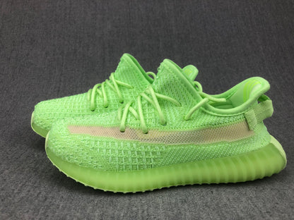 Pair of glow-green sneakers shown in a side-by-side perspective view.