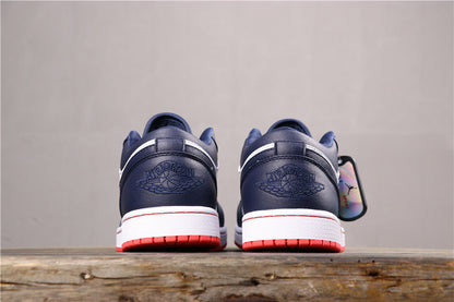 Rear view of the pair showing dark blue heel panels, embossed winged branding, white midsole, and red outsoles.