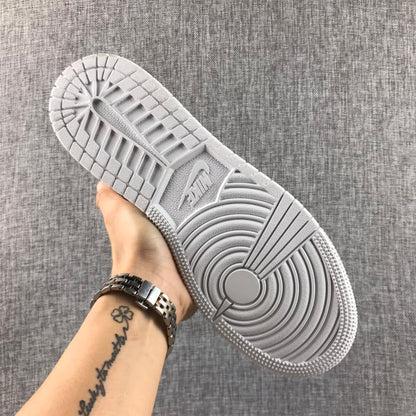 Underside view of the white outsole and circular tread details.