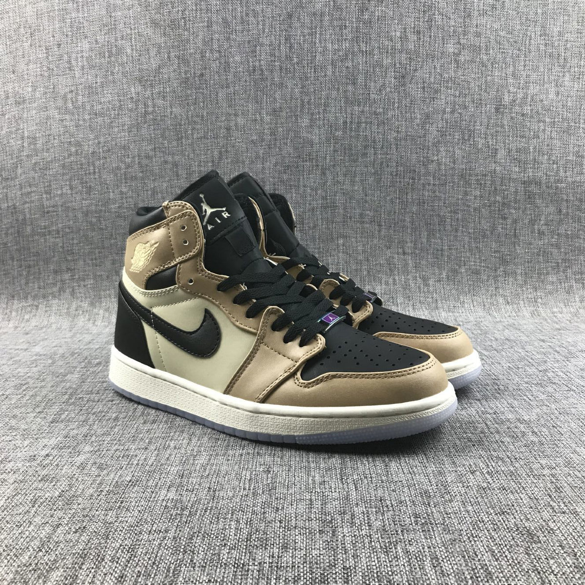 Front three-quarter view of the pair showing black perforated toe panels and black laces.