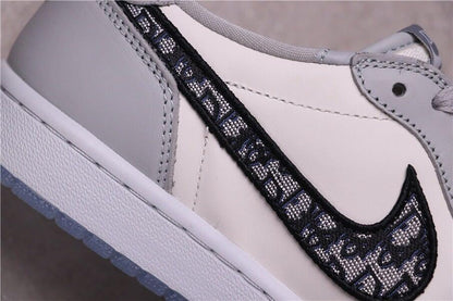 Close-up of the black patterned side Swoosh against the light grey upper.