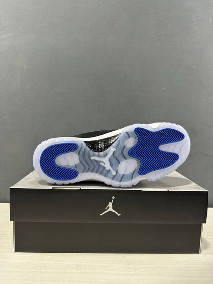 Bottom view showing the translucent outsole with blue traction sections and a dark midfoot panel.