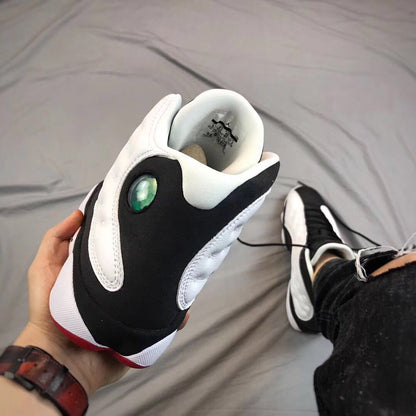 Close view of the heel and collar area, including the circular side detail and padded lining.