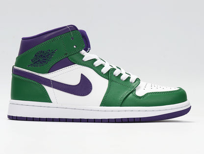 Side profile of a green, white and purple high-top sneaker showing the Jordan Wings logo and purple Swoosh.