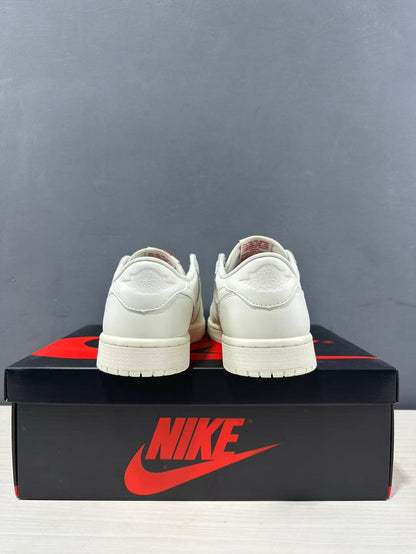 Rear view of a pair of white low-top Jordan sneakers showing heel panels and embossed wing-style branding.