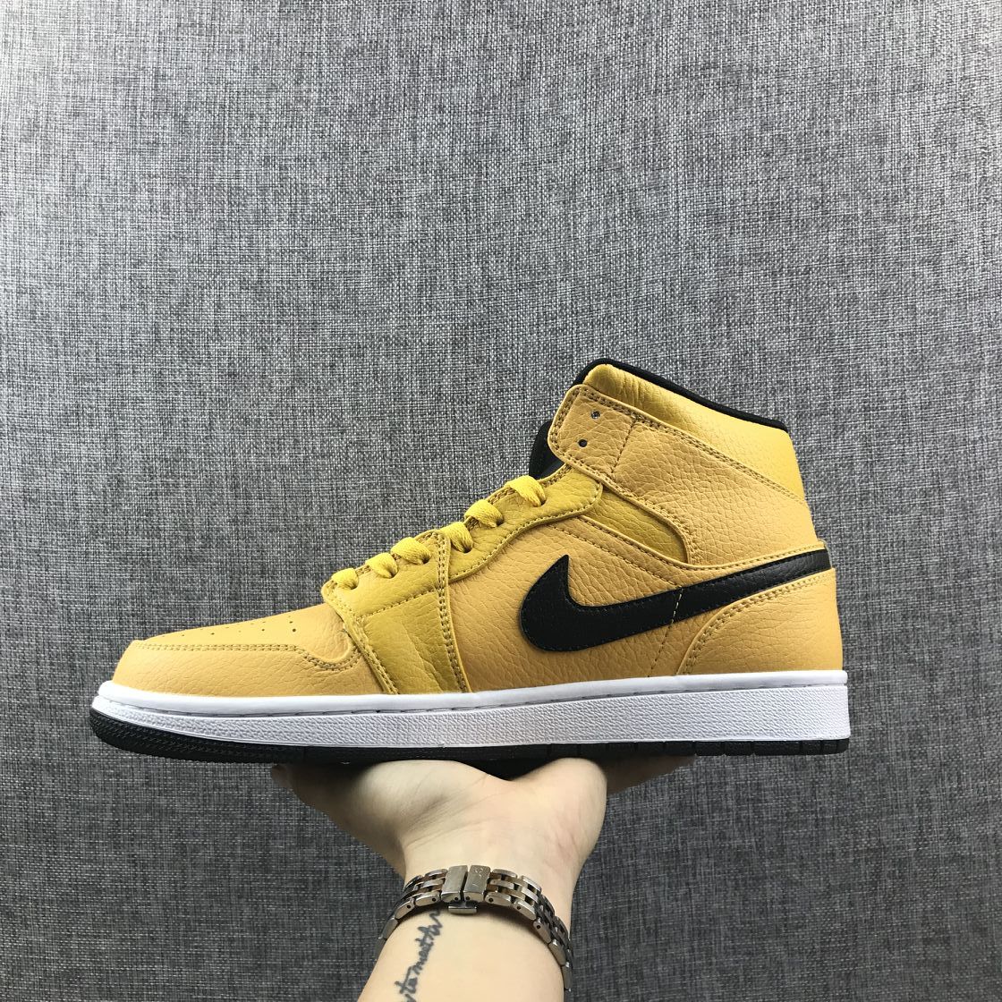 Full side view of the yellow mid-top sneaker with black Swoosh and layered panels.