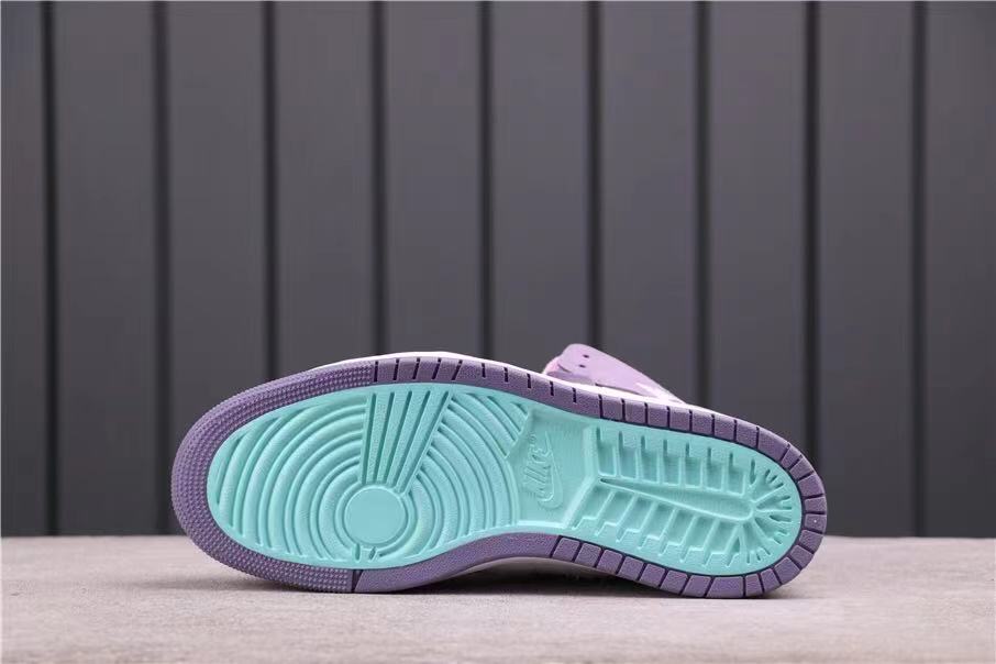 Underside view showing the teal and lavender rubber outsole pattern.