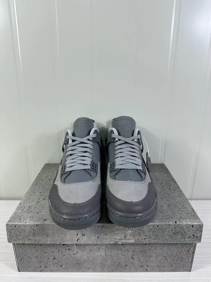 Front view of the pair showing the tonal laces, perforated detailing, and grey toe panels.