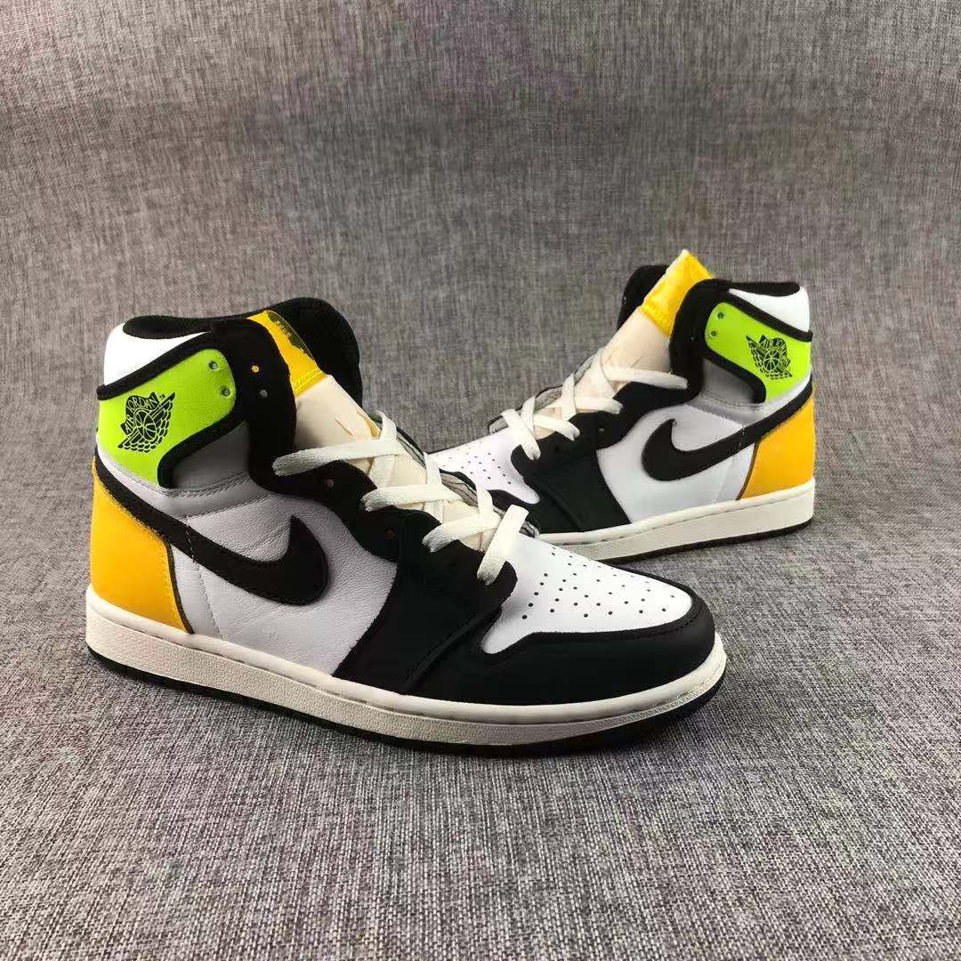 Pair of high-top sneakers shown from the side with Volt collars and yellow-gold heel panels.