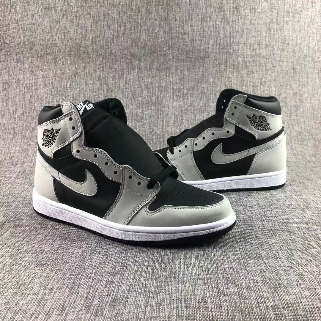 Front three-quarter view highlighting the high-top shape, contrasting overlays, and side Swoosh.