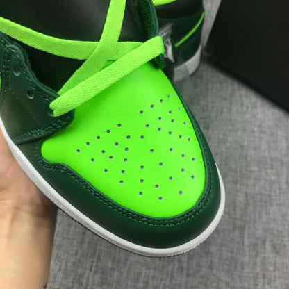 Close-up of a fluorescent green perforated toe box with matching laces.