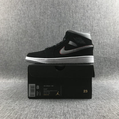 Air Jordan 1 Mid sneaker displayed on its box; the box shows EUR 41, UK 7, style code 554724 060 and black, grey and white color text.