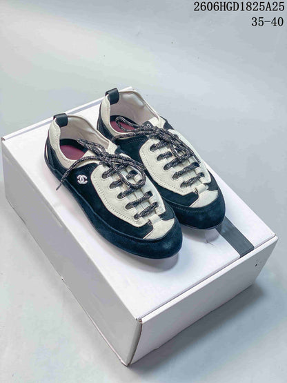 Chanel Two-Tone Low-Top Trainer in Black and Ivory