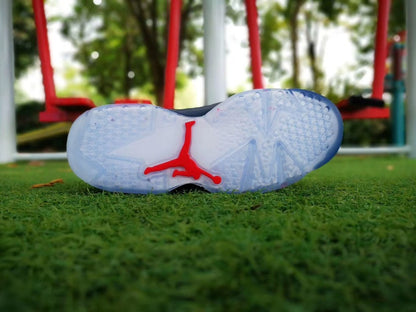 Outsole view showing the translucent sole and red Jumpman-style logo detail.