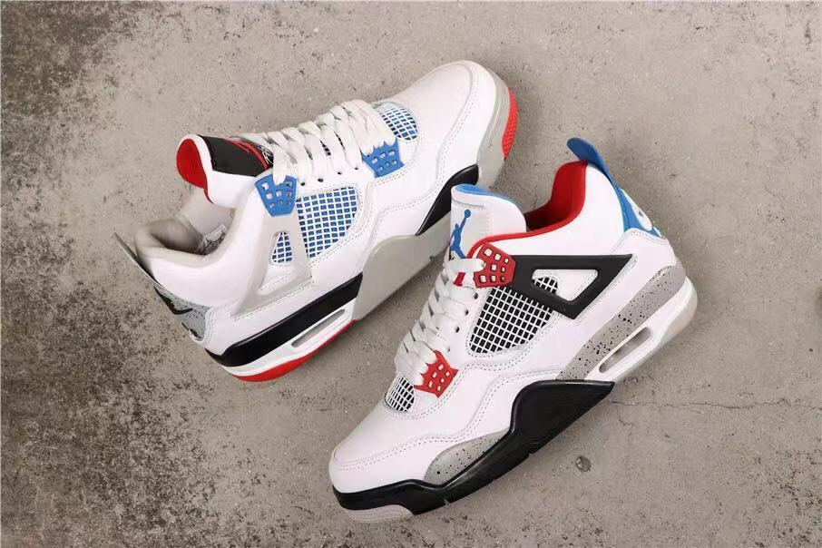 Angled view of the pair displaying the white, red, blue, black, and grey color blocking.
