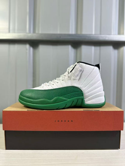 Side profile of a white and green Jordan Air Jordan 12 sneaker on a shoebox.