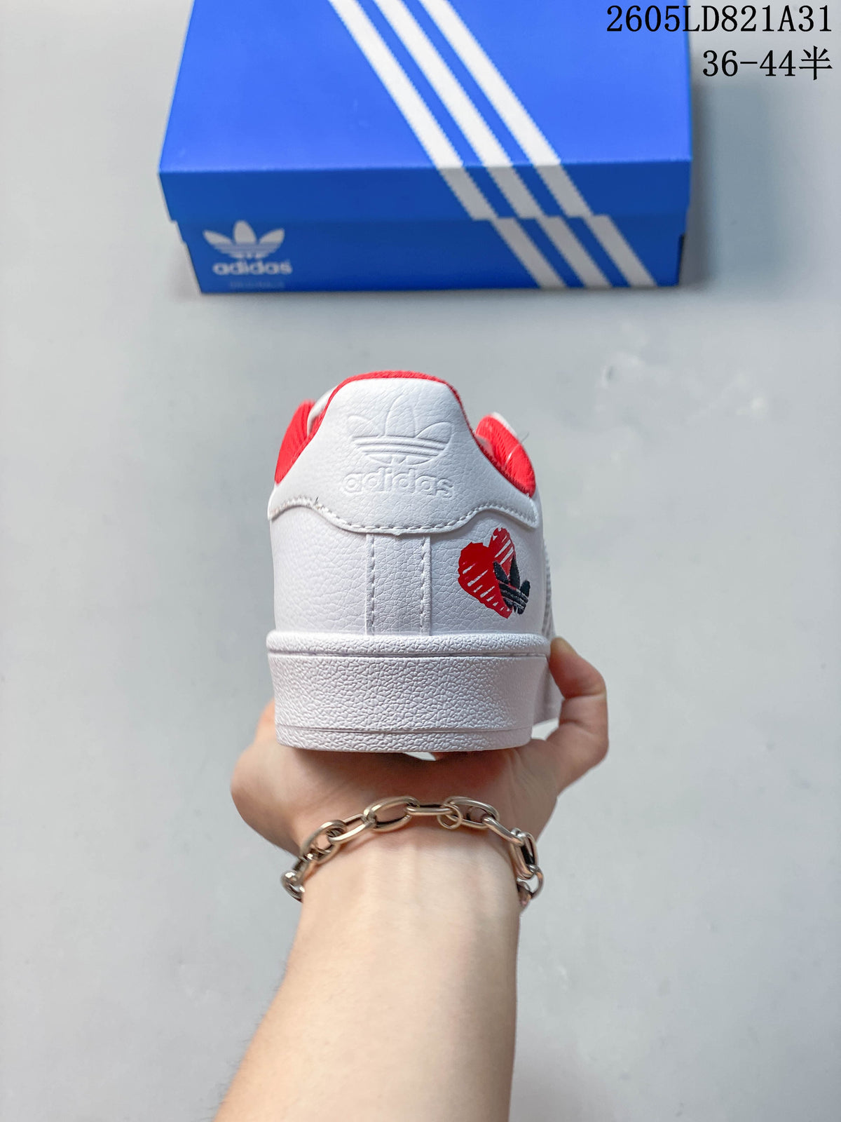 Adidas Superstar White Low-Top Sneakers with Red Accents