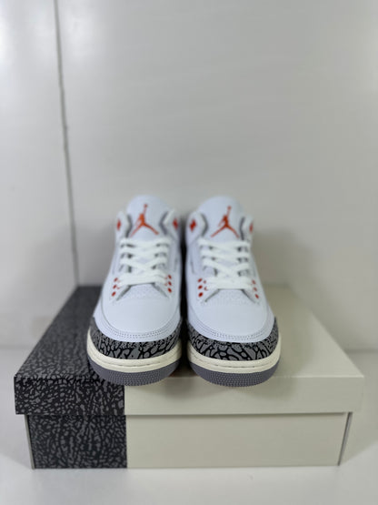 Front view of the pair showing white laces, red eyelet accents, Jordan tongue logos, and elephant-print toe overlays.