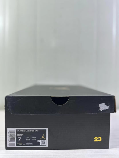 Black shoebox with a visible Air Jordan Legacy 312 Low label showing black/white color details, style code CD7069-001, and EU 40 sample sizing.