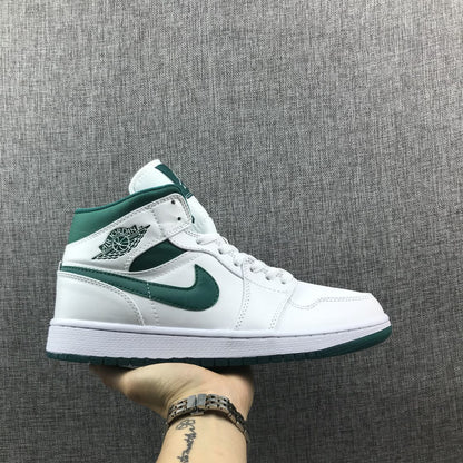 Side profile of a white and Mystic Green Jordan mid-top sneaker.