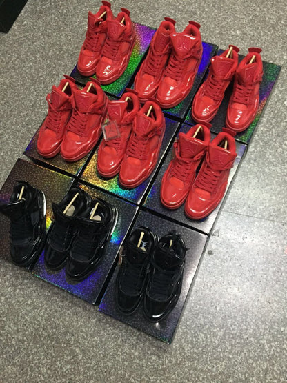 Group display of red and black high-top sneakers viewed from above and at an angle.