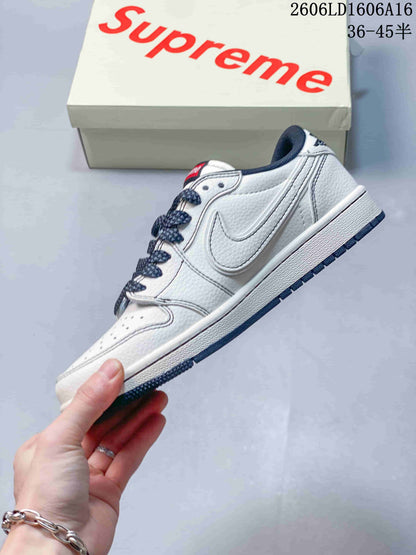 Jordan 1 Low Sneakers in White and Navy