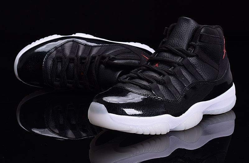 Black high-top sneakers with glossy black forefoot panels, black laces, and white translucent outsoles.