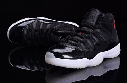 Black high-top sneakers with glossy black forefoot panels, black laces, and white translucent outsoles.