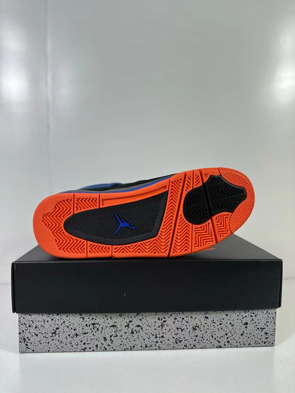 Air Jordan 4 sneaker outsole showing orange tread, black traction sections and a blue Jordan logo.