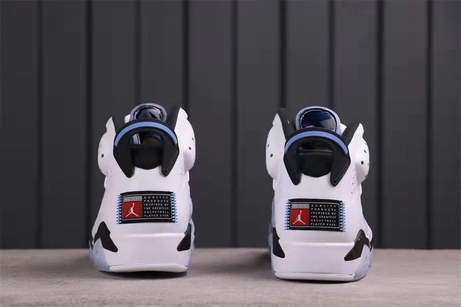 Rear view showing the heel pull tabs, black heel details, and rectangular heel branding patches.