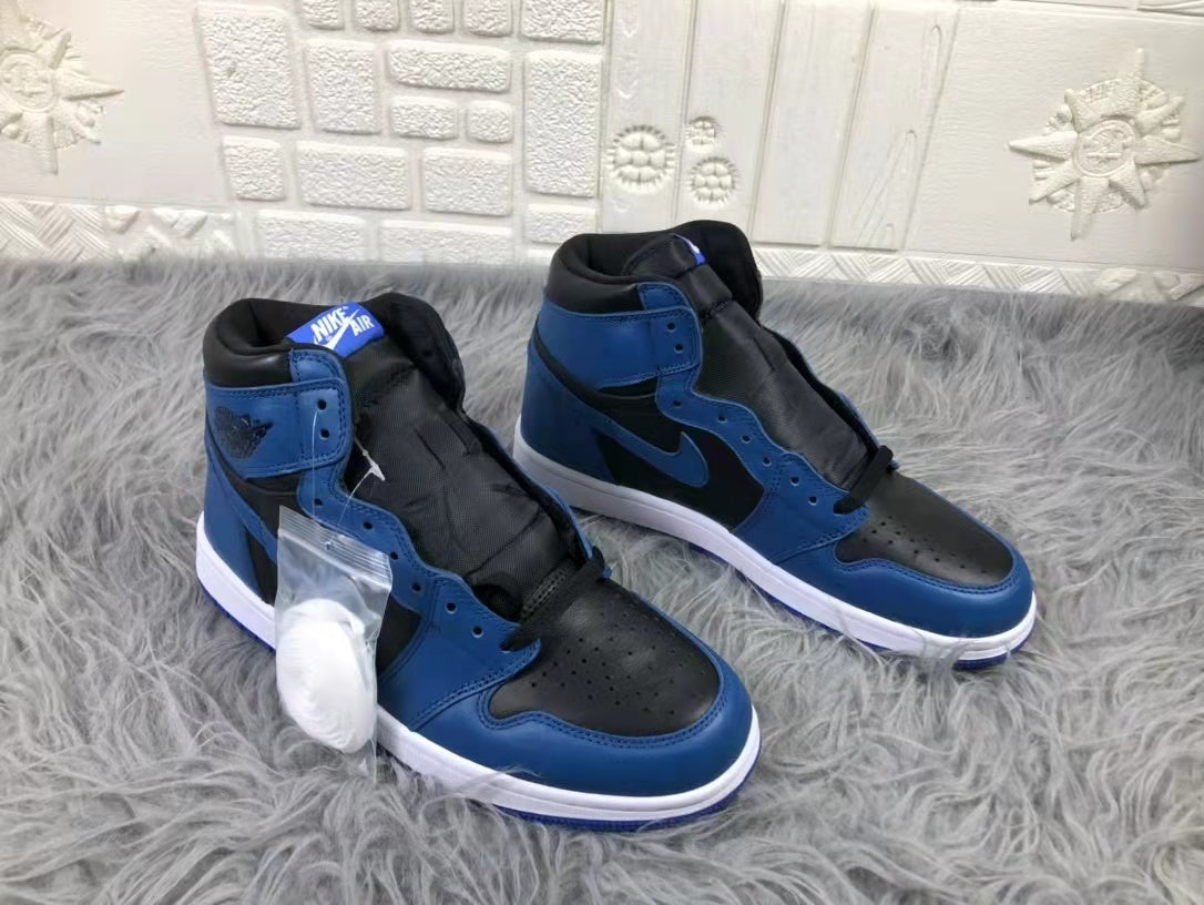 Pair of black and blue high-top sneakers shown from a three-quarter front angle with perforated toe boxes and white midsoles.