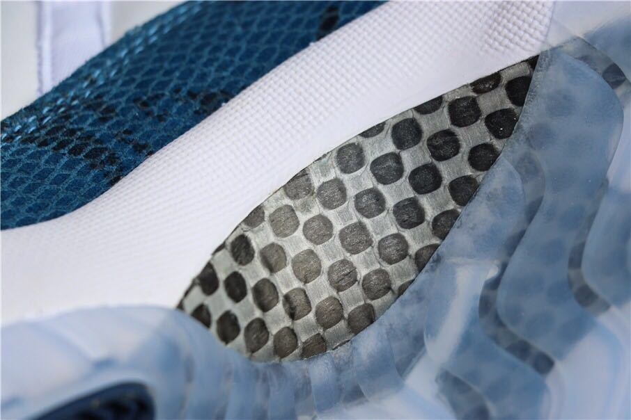 Close-up of the patterned navy upper and translucent outsole detail.