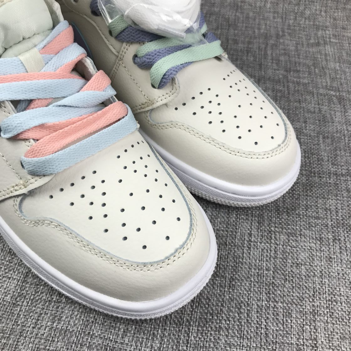 Close-up of both perforated toe boxes with pink-and-blue and mint-and-lavender lace combinations.