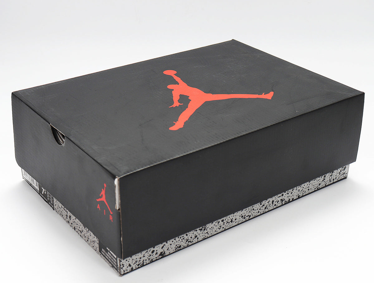 Black Jordan shoebox with red Jumpman logo and speckled gray trim