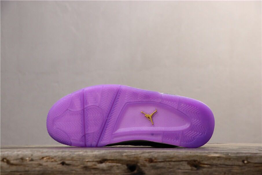 Bottom view showing the translucent purple outsole and traction pattern with a Jordan logo.
