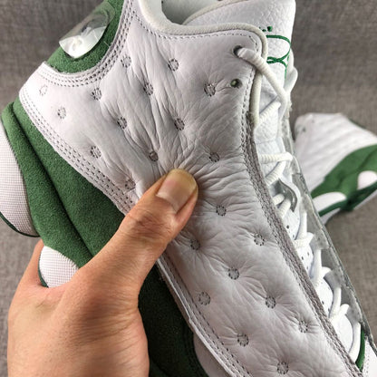 Close-up of the textured white side panel and decorative stitching on the sneaker upper.