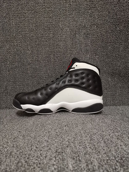 Side profile of a black and white Air Jordan 13 Retro high-top sneaker