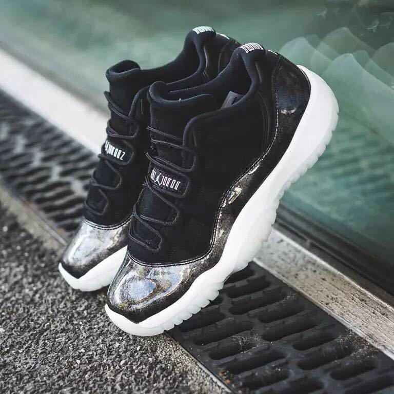 Lifestyle image showing the pair from above on a walkway, with silver toe panels and translucent outsoles visible.
