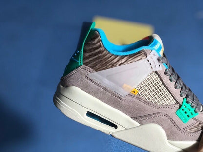 Close side view of the grey upper, mesh side panel, translucent support wing, and teal accents.
