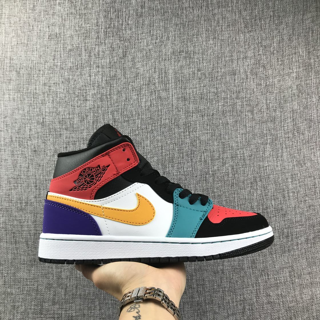 Side view of a multicolor Jordan high-top sneaker with red, teal, yellow and purple panels.