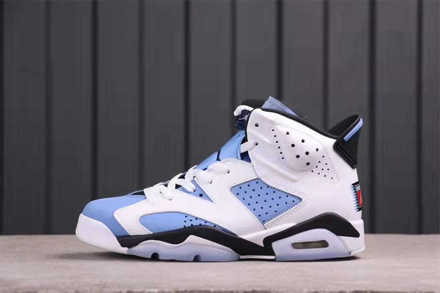 Opposite side profile highlighting the perforated side panels, University Blue overlays, and black midsole accents.