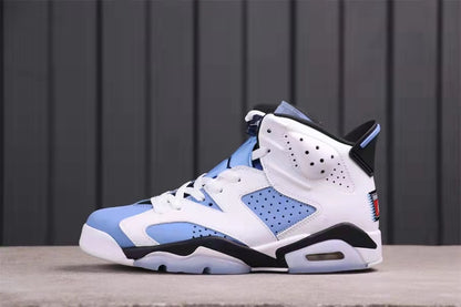 Opposite side profile highlighting the perforated side panels, University Blue overlays, and black midsole accents.