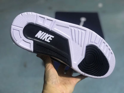 Underside of the sneaker showing a white and black patterned outsole.