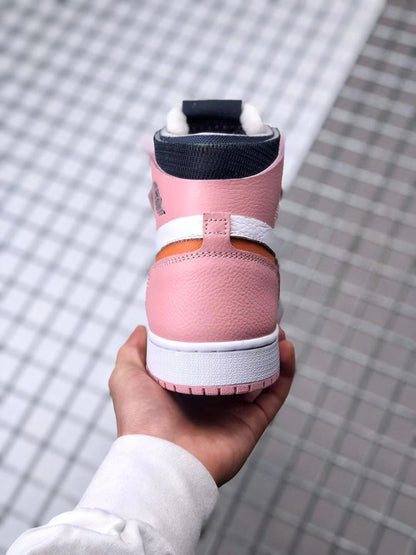 Rear view showing the pink heel, white midsole, black collar lining, and orange accent.