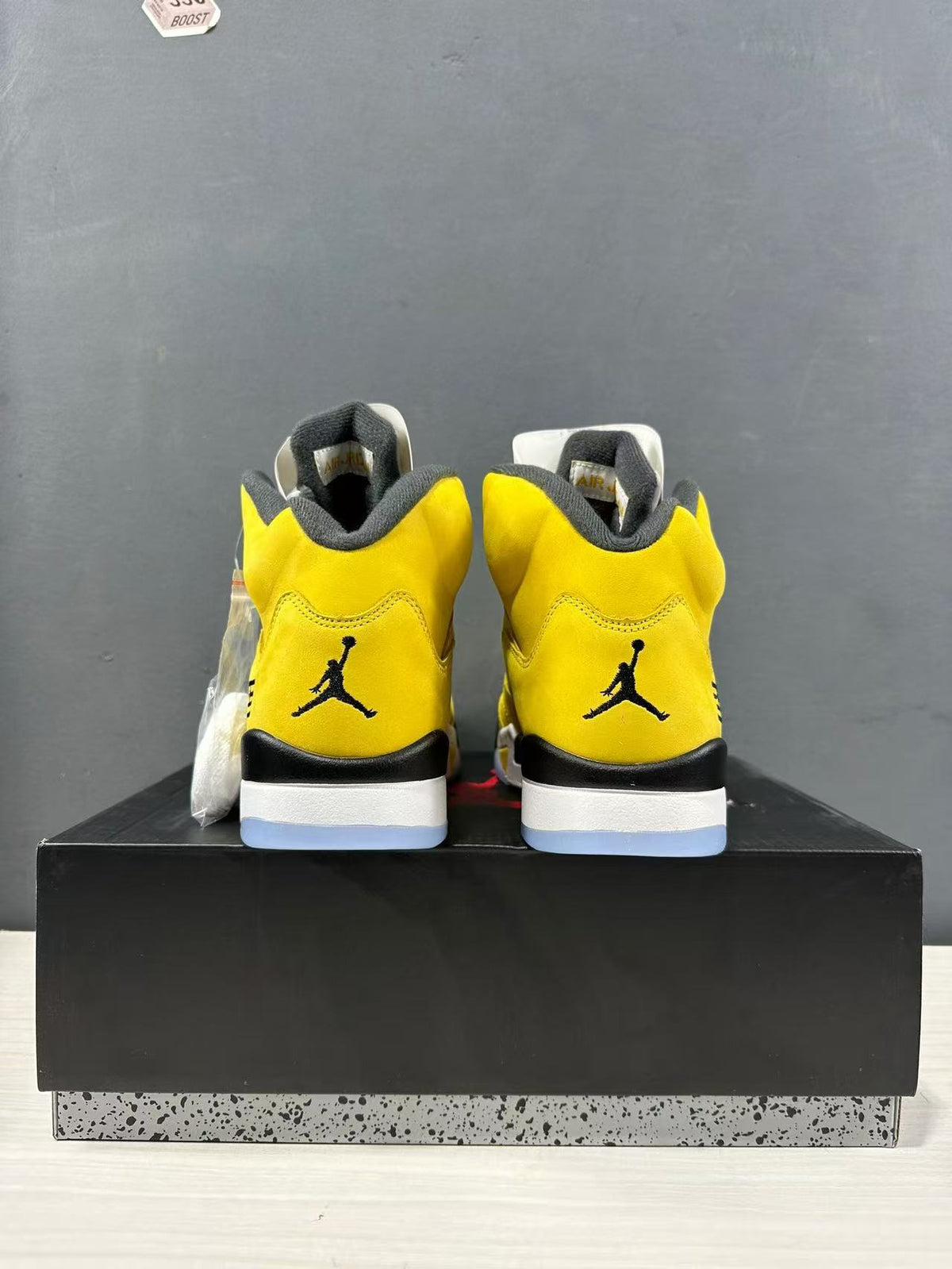 Rear view of the pair showing black heel logos and layered midsoles.