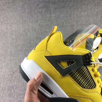 Detailed side view highlighting the black support overlay, yellow upper, stitching, and mesh panel.