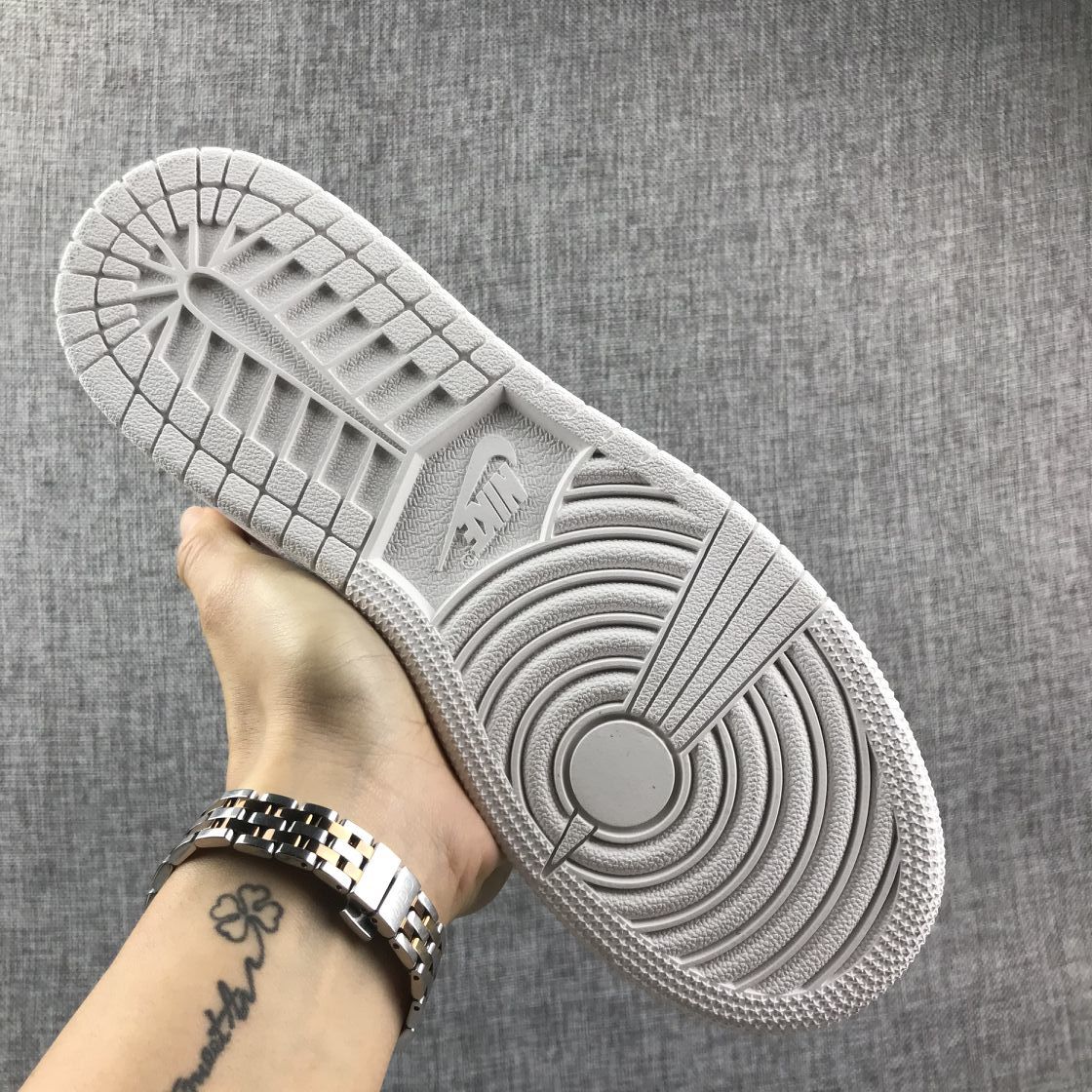 Underside view showing the white rubber outsole with circular and segmented traction grooves.