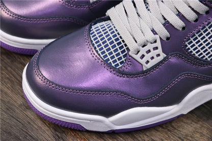 Close-up of the toe area showing the purple-blue finish, white laces, mesh panel, and white midsole.
